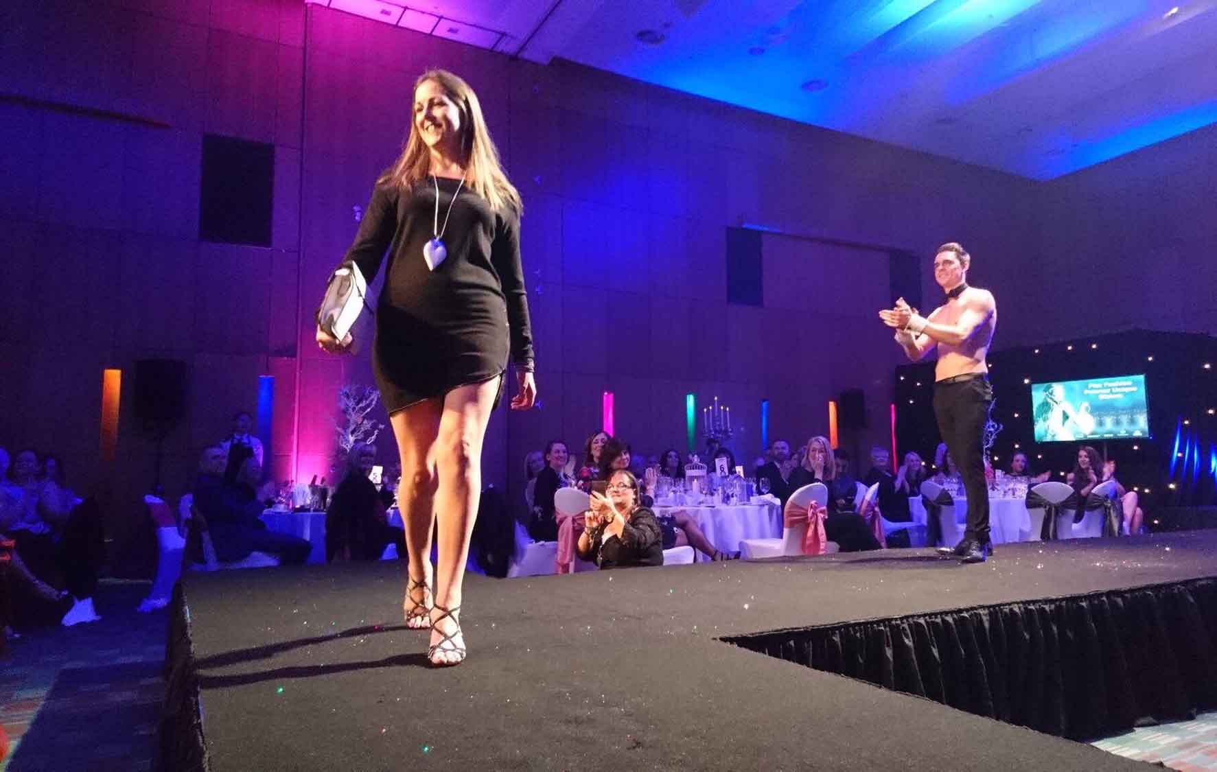 buff butler on stage clapping